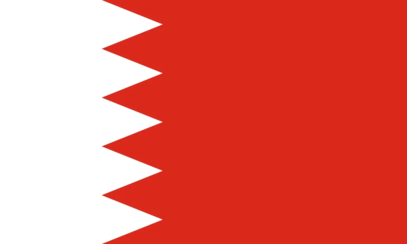 The flag of Bahrain consists of a red field with a white serrated band on the left side, featuring five white, jagged points that symbolize the five pillars of Islam.