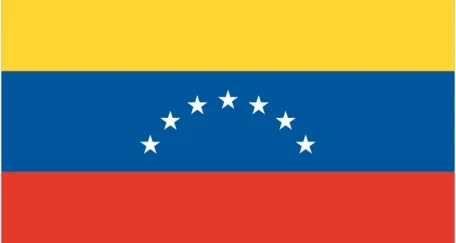 Flag of Venezuela with three horizontal stripes: yellow at the top, blue in the middle, and red at the bottom, featuring a white arc of eight stars in the center of the blue stripe and the national coat of arms in the upper left corner.