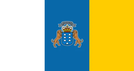 The flag is a vertical tricolor of white, blue, and yellow stripes. The state flag also features the Canary Islands' coat of arms in the center. 