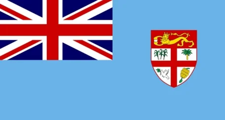 The flag of Fiji has a light blue field with the Union Jack in the upper hoist corner and the national coat of arms on the fly side.