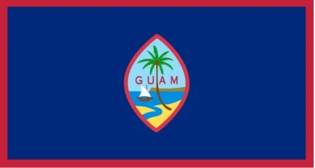 The flag of Guam features a dark blue field with a red border and the Guam seal in the center, which shows a proa (canoe) sailing in Agana Bay with a coconut tree.