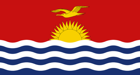 The flag of Kiribati features a red field with a yellow frigatebird flying over a rising sun, above a blue and white wavy stripe representing the ocean.