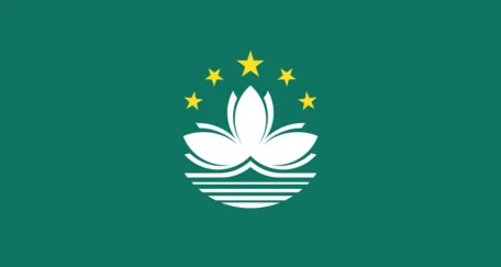 The flag of Macau features a green field with a white lotus flower above a stylized bridge and water, symbolizing the region's cultural heritage and connection to the sea.