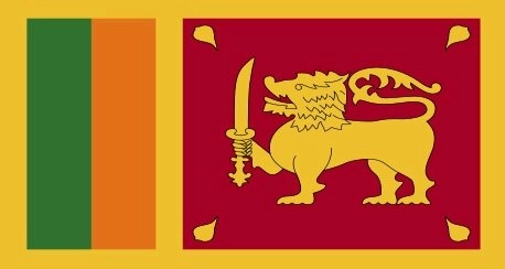 Flag of Sri Lanka: a yellow field with two vertical panels; the left panel is green and orange, and the right panel is maroon with a yellow lion holding a sword and four yellow leaves in each corner.