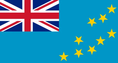 The flag of Tuvalu features a light blue field with the Union Jack in the canton (upper left corner) and nine yellow stars arranged in a diagonal pattern. The blue represents the ocean, while the stars symbolize the nine islands of Tuvalu.